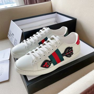 Women's Fashion Gucci Ace Luxury Arrow Shaped Cristal & Bead Patch White Leather Asymmetric Fake Sneakers